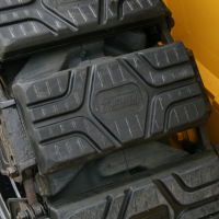 Steel vs. Rubber Skid Steer Over-the-Tire-Tracks