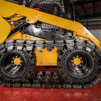 Over-The-Tire Tracks vs. Dedicated Track Loaders 